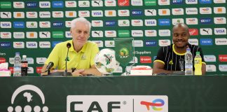 Coach Hugo Broos and Percy Tau
