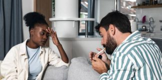 Couple smoking cigarettes