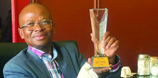 DID Head of Department: Mr Rufus Mmutlana holding the Batho Pele Award