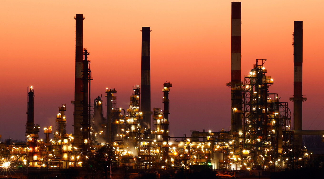 Chimneys of the Total Grandpuits oil refinery at sunset southeast of Paris