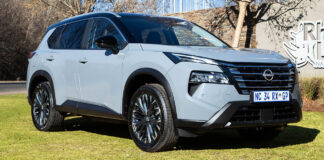 Front view of the new silver Nissan X-Trail family SUV parked outdoors