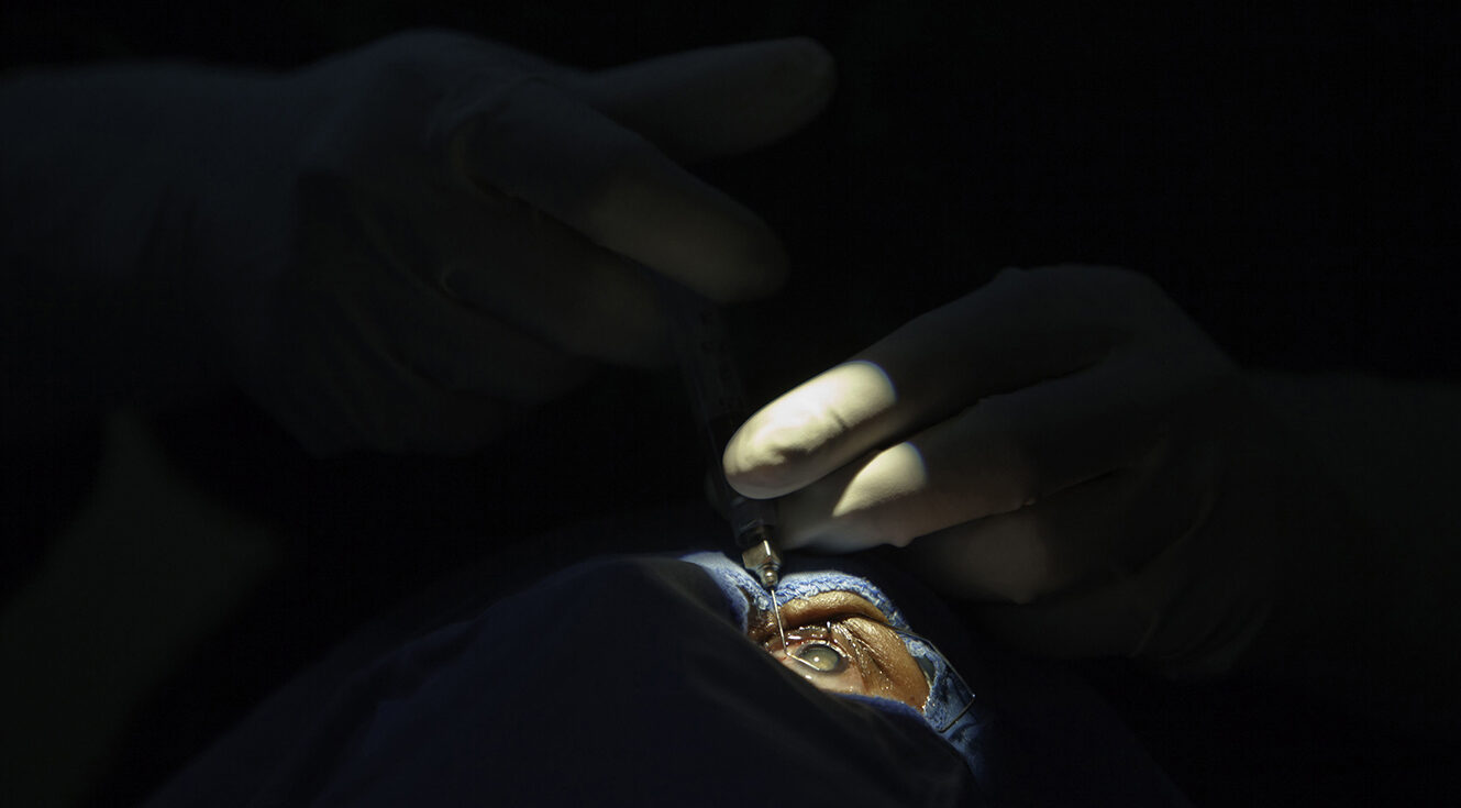 Surgeon performing cataract surgery on a patient in a medical operating room