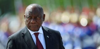 South Africa's President Cyril Ramaphosa reviews an honour guard while meeting Brazil's President Luiz Inacio Lula da Silva.