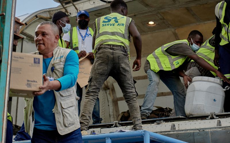 UNICEF staff and airport workers receive medical supplies at Bunia National Airport in Democratic Republic of Congo.