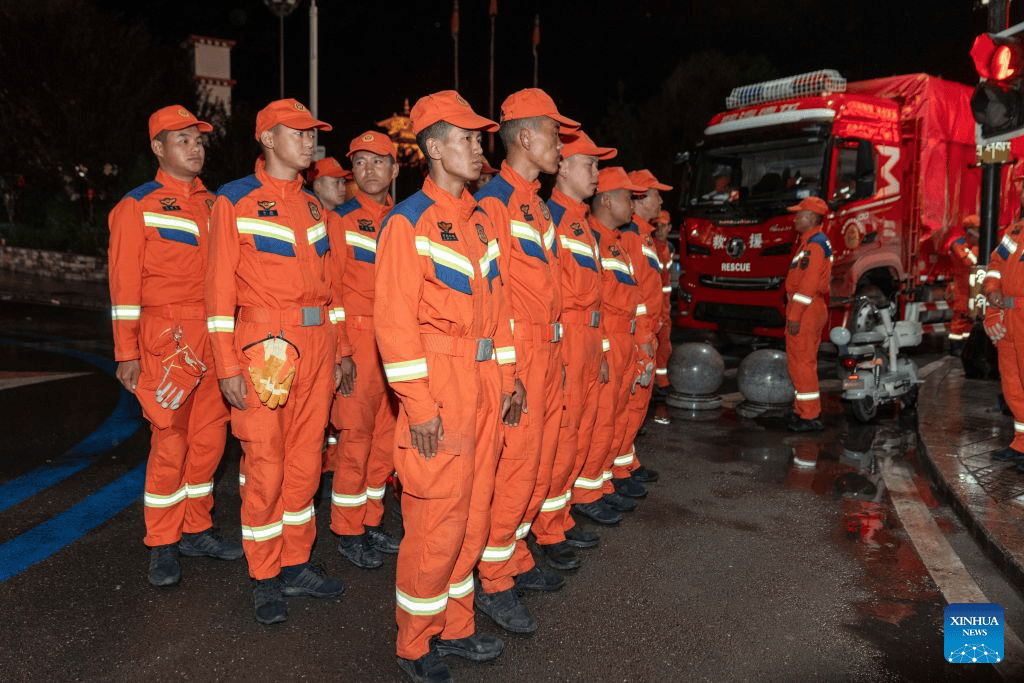 Rescuers prepare before heading to the mudslide-stricken Gyirong Port in Gyirong County, southwest China's Xizang Autonomous Region, Aug. 27, 2026.