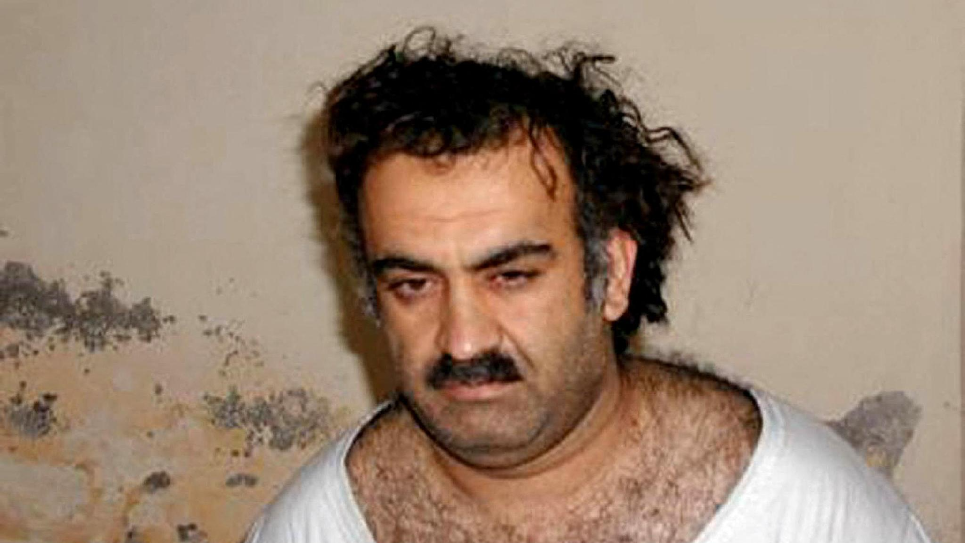 Khalid Sheikh Mohammed after his capture in March 2003, showing him in a simple shirt.