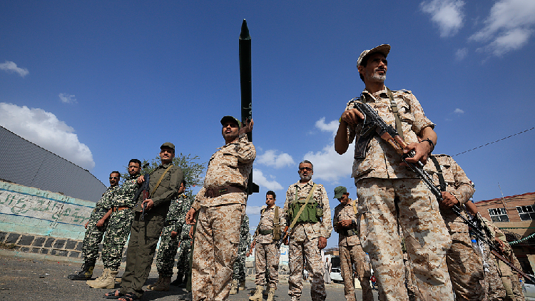 Houthi fighters gather during a campaign to mobilize more fighters