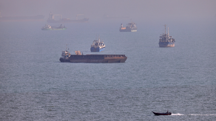 Commercial vessels seen anchored in the Strait of Hormuz off Bandar Abbas, Iran, August 5, 2026. /VCG