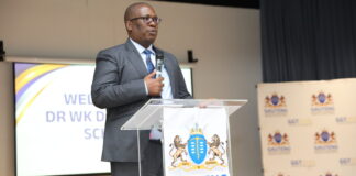 Gauteng Premier Panyaza Lesufi addressing guests at an infrastructure launch podium